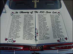 The trunk bears the names of the fire victims.