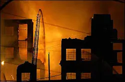 Firefighters battle a seven alarm fire in a warehouse located on Adams Ave. in the Juniata Park section of Philadelphia, April 21. Firefighters battle a seven alarm fire in a warehouse located on Adams Ave. in the Juniata Park section of Philadelphia, April 21.