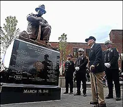 Retired Brockton fire Chief Edward Burrell, 93, views the new monument, topped by his likeness, to the fallen heroes of the Strand Theatre fire. Retired Brockton fire Chief Edward Burrell, 93, views the new monument, topped by his likeness, to the fallen heroes of the Strand Theatre fire.