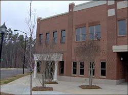 Provided that you pre-plan the new construction in your district, you would know that this building is constructed of wood framing with a brick facade. Provided that you pre-plan the new construction in your district, you would know that this building is constructed of wood framing with a brick facade.