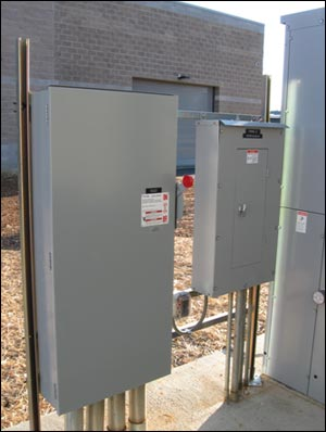 Electrical equipment can be found in a variety of locations and responders need to be able to identify each piece. This photo shows a disconnect switch for a piece of HVAC equipment (left) and a sub panel located on the building's exterior.