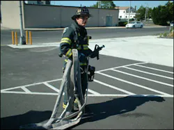 Figure 2 - Here, the nozzle firefighter has the nozzle and 50 feet of hose that he will bring to the drop point. The nozzle firefighter drops the 50 feet in an area that is relatively close to the fire's location, but not so close that the team is in an IDLH environment. The drop point uses compartmentation, elevation, or exterior advantages to stretch the line dry. This allows for a much quicker stretch but without placing the members in danger. The drop point also should offer enough room to flake out the line so as to prevent kinks. Figure 2 - Here, the nozzle firefighter has the nozzle and 50 feet of hose that he will bring to the drop point. The nozzle firefighter drops the 50 feet in an area that is relatively close to the fire's location, but not so close that the team is in an IDLH environment. The drop point uses compartmentation, elevation, or exterior advantages to stretch the line dry. This allows for a much quicker stretch but without placing the members in danger. The drop point also should offer enough room to flake out the line so as to prevent kinks.