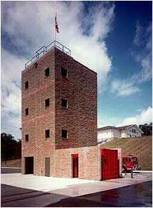 The drill tower and training ground. The rear of the station is visible on the hill.Photos by Chief Kenny Lane