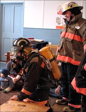Assistant Chief John P. 'Jack' Horton is seen on the right.