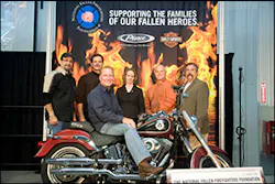 Mark Jones, vice president of sales and service for Pierce dealership Ten-8 Fire Equipment Inc. of Bradenton, Fla. received the keys to a custom, one-of-a-kind Harley-Davidson Fat Boy Firefighter Special Edition motorcycle. Behind Mark (left to right): Bill Davidson, Harley-Davidson Motor Company; Wilson Jones, Oshkosh Corporation; Allyson Murphy, National Fallen Firefighters Foundation; Joe Pritchard, Pritchard Chassis Corporation; and Ron Siarnicki, National Fallen Firefighters Foundation. Mark Jones, vice president of sales and service for Pierce dealership Ten-8 Fire Equipment Inc. of Bradenton, Fla. received the keys to a custom, one-of-a-kind Harley-Davidson Fat Boy Firefighter Special Edition motorcycle. Behind Mark (left to right): Bill Davidson, Harley-Davidson Motor Company; Wilson Jones, Oshkosh Corporation; Allyson Murphy, National Fallen Firefighters Foundation; Joe Pritchard, Pritchard Chassis Corporation; and Ron Siarnicki, National Fallen Firefighters Foundation.