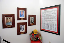 A Team Brian Poster, with signatures from all members of the Amarillo Fire Department hangs on the wall of the station. The three photos memorialize the department's four line of duty deaths, including Brian Hunton, who is top center. A Team Brian Poster, with signatures from all members of the Amarillo Fire Department hangs on the wall of the station. The three photos memorialize the department's four line of duty deaths, including Brian Hunton, who is top center.