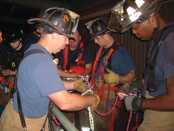 Captain Michael Conlin and members of Rescue 1 set up the equipment needed for the operation.