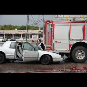 Colorado Springs firefighters jumped into action after a car slammed into the rear of their engine last night, leaving three civilians injured.