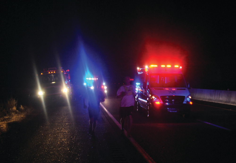 Runners switch off as the Golden Valley FD Fire Engine takes over for the Bullhead City FD Rescue/Ambulance early Monday, Aug. 16, 2010.