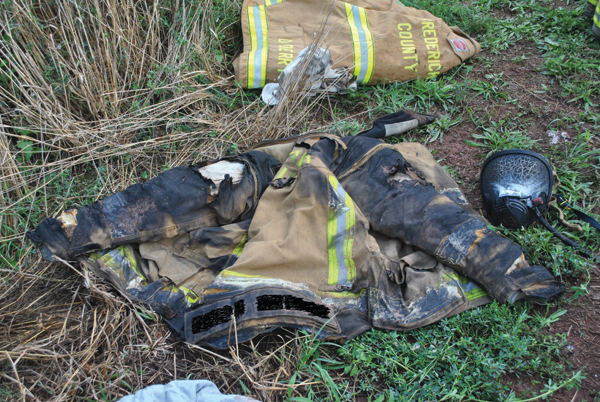 Firefighter Jed Gregory&rsquo;s account of the incident says, &ldquo;The heat became intense and within seconds the room that was previously showing only light smoke was fully involved in flames.&rdquo; After leaving the structure unassisted, he was treated for first- and second-degree burns to both hands, forearms, left elbow and right shoulder. The photo shows his turnout coat and facepiece.