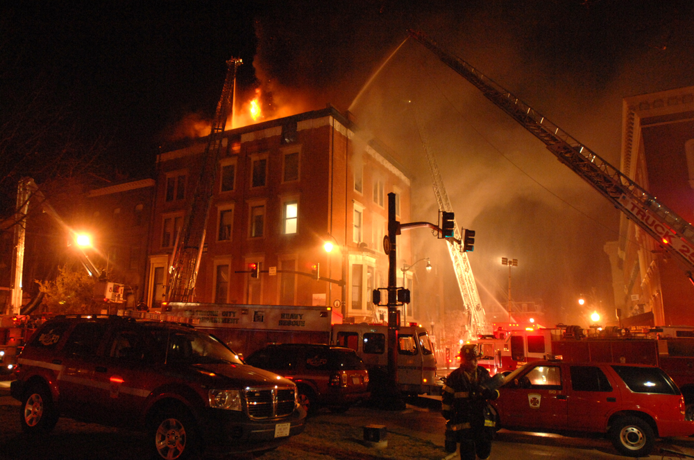 Baltimore firefighters work on a multiple-alarm dwelling fire on Charles Street in Mount Vernon in Baltimore.