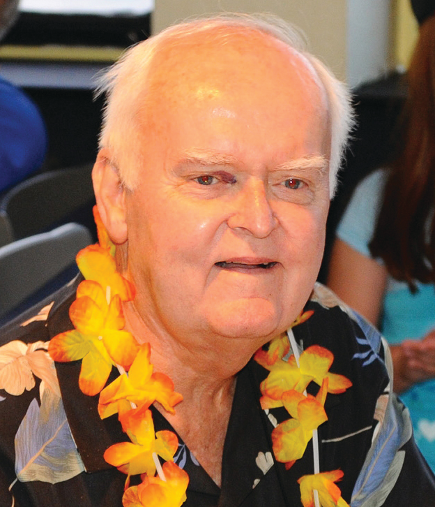 Bob Barraclough is applauded for his service during an event at Firehouse Expo 2010.