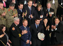 Australian Firefighter Rob Frey, third from front left, and FDNY Firefighter James Dowdell, holding helmet, are recognized in a speech by Australian Prime Minister Julia Gillard. Australian Firefighter Rob Frey, third from front left, and FDNY Firefighter James Dowdell, holding helmet, are recognized in a speech by Australian Prime Minister Julia Gillard.