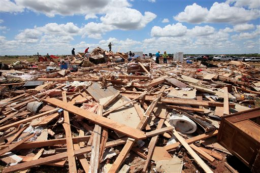 Tornado aftermath cleanup east of Piedmont, Okla. is seen on May 25.
