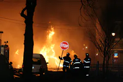 An A Division second-alarm company monitors an unmanned deluge gun covering the D exposure. An A Division second-alarm company monitors an unmanned deluge gun covering the D exposure.