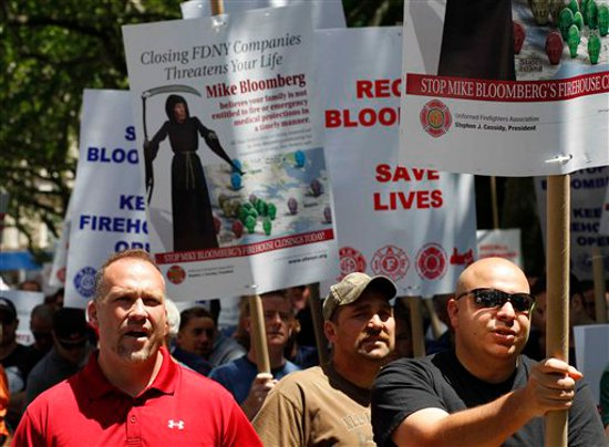 Supporters gather at a 'Save the Fire Companies' rally near City Hall to protest New York City Mayor Michael Bloomberg's plan to close 20 fire companies.