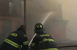 Firefighters battle a massive 12-alarm blaze Thursday at a former tire-distribution facility in Camden. Firefighters battle a massive 12-alarm blaze Thursday at a former tire-distribution facility in Camden.