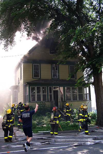 A firefighter points towards the attic moments after the explosion rocked the fireground.