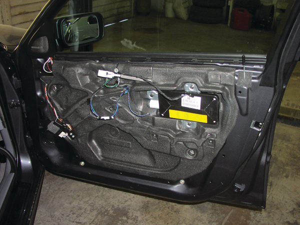 Stored gas inflators for door airbags are integrated into one airbag module. Door airbags are near the latch end of the door, above the armrest.