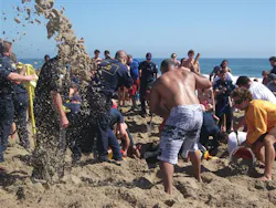 Rescuers dig out Matt Mina, 17, who was buried underneath six feet of sand in Newport Beach, Calif. Rescuers dig out Matt Mina, 17, who was buried underneath six feet of sand in Newport Beach, Calif.