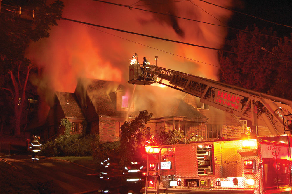 PASSAIC, NJ, AUG. 31, 2011 &ndash; Units were dispatched to an early-morning house fire. First-due units arrived to find a large, 1&frac12;-story frame dwelling with heavy fire in the basement, first floor and attic. A second alarm was transmitted. After confirming the structure was vacant, an exterior attack was commenced. One ladder pipe, a tower ladder and several handlines were put into operation. After about two hours, most of the heavy fire was knocked down and the fire was placed under control.