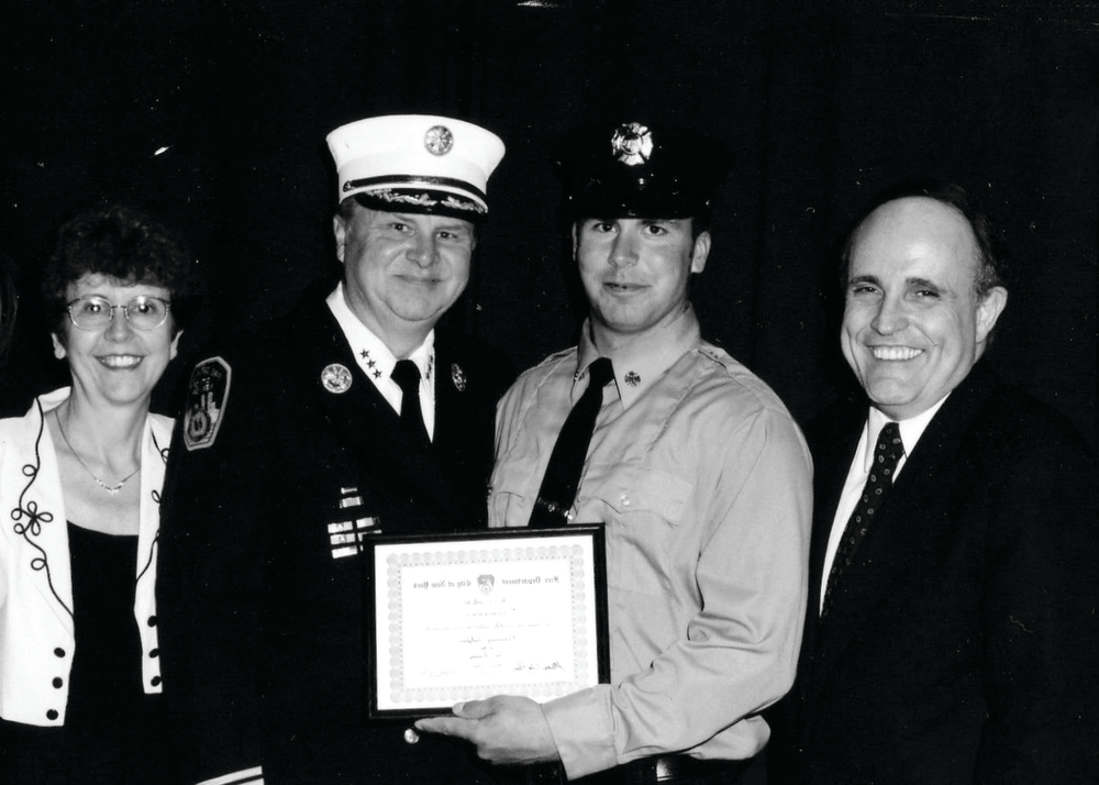 Chief Donald J. Burns (second from left) at his son Patrick&rsquo;s induction ceremony, with his wife, Elizabeth, and former New York City Mayor Rudy Giuliani.