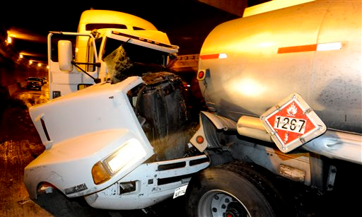 The crash involved eight big rigs and nine other vehicles that collided in the truck lane tunnel on rain-slicked Interstate 5.