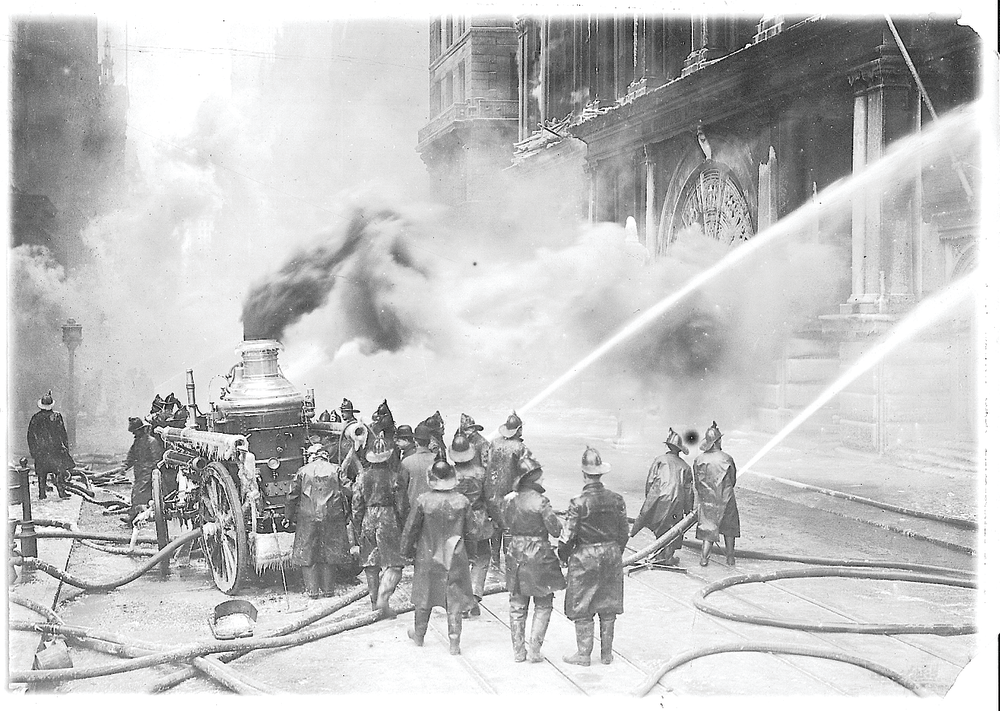 Powerful handlines are directed into the blazing building during the early stages of the fire.