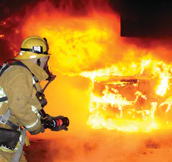 A firefighter waits for water on a few well-involved cars after the arsonist moved from Hollywood to the San Fernando Valley a few miles to the north. Photo by Gene Blevins A firefighter waits for water on a few well-involved cars after the arsonist moved from Hollywood to the San Fernando Valley a few miles to the north. Photo by Gene Blevins