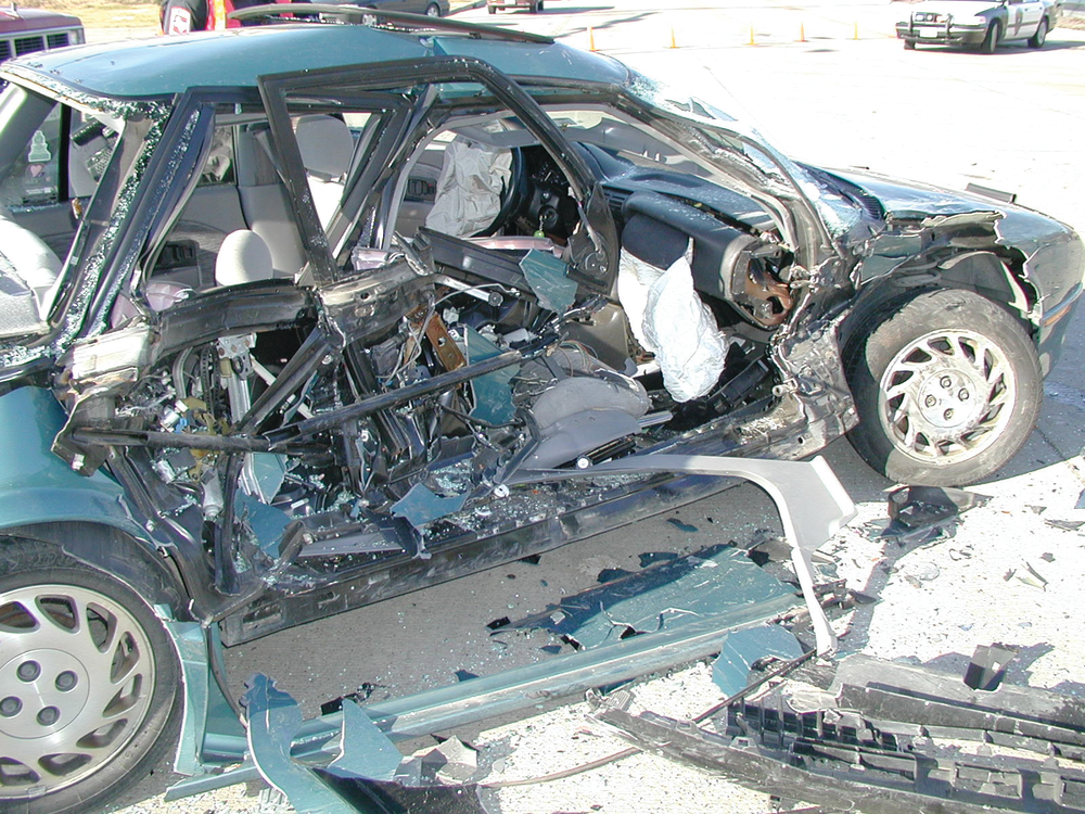 This T-bone intersection collision involved an SUV crashing into the passenger&rsquo;s side of this Saturn. The lightweight plastic-like construction of the doors failed significantly. If the rear door needed to be opened, it would be best if the rescue team were skilled in working with lightweight door construction.