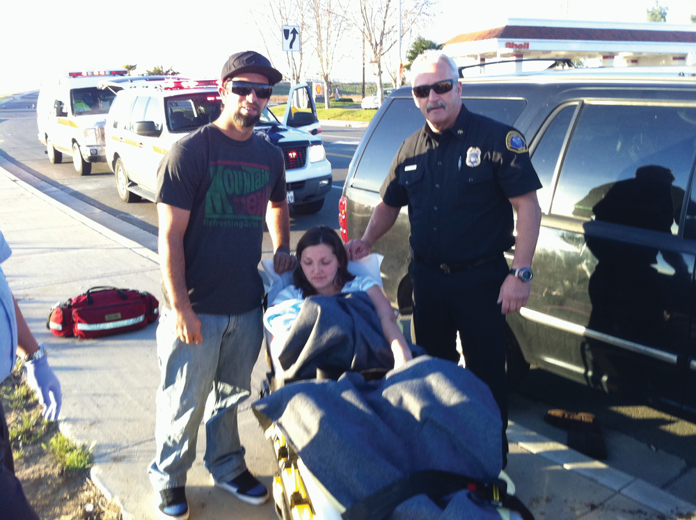 Chief Horton poses with the Holmquist family shortly after delivering the newest member.