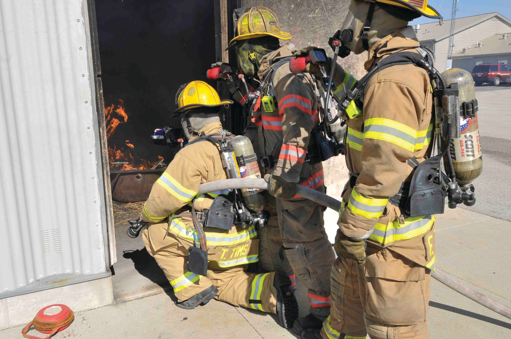 Firefighters use thermal imagers during a training evolution. Instructors can monitor students' use of the imagers to ensure they are being used appropriately.