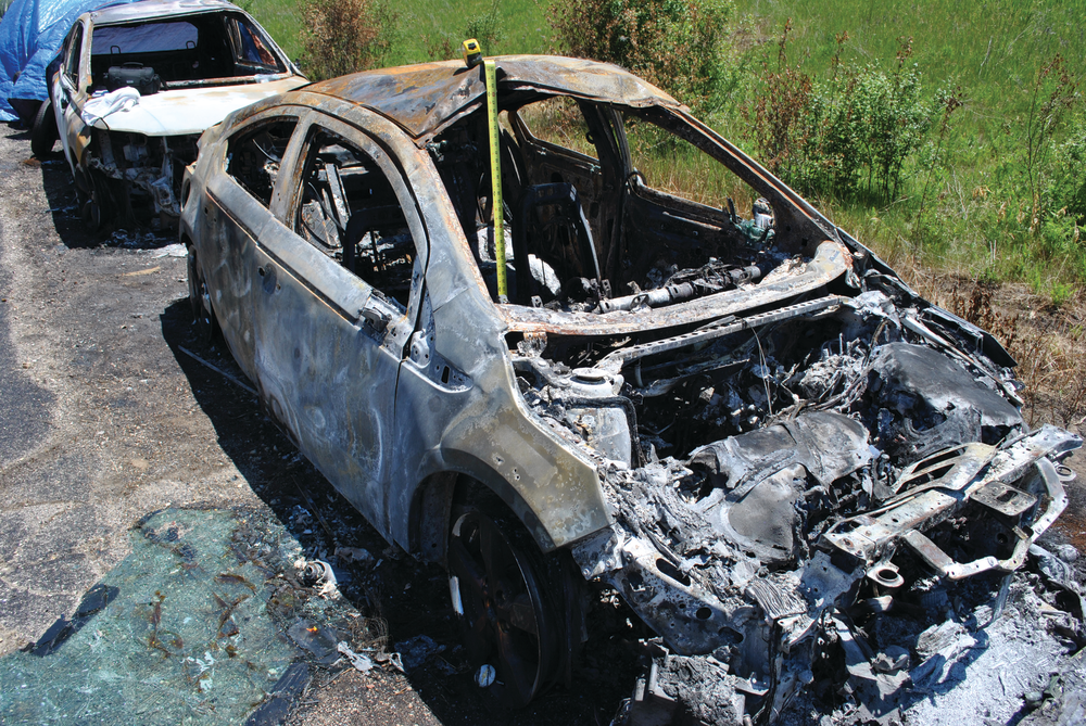 High-voltage lithium ion batteries will be damaged by a vehicle fire to this extent. Special new protocols need to be followed by fire department personnel.