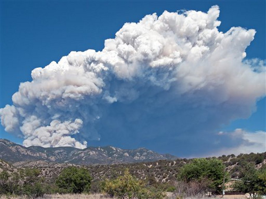 A plume of smoke is seen rising from the Whitewater fire burning in the Gila Wilderness east of Glenwood, N.M. on May 22.