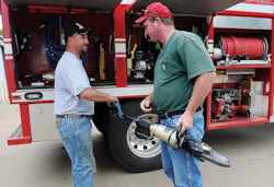 Kremlin Firefighter Chris Henry, left and Fire Chief Derrick Harris check out hydraulic extrication tools used to free two teens following a grain auger accident last August. Kremlin Firefighter Chris Henry, left and Fire Chief Derrick Harris check out hydraulic extrication tools used to free two teens following a grain auger accident last August.