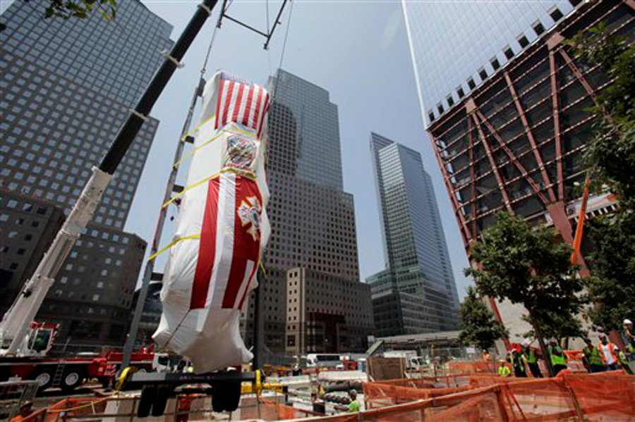 FDNY's Ladder Company 3 fire truck is lowered by crane into the National September 11 Museum on July 20, 2011.