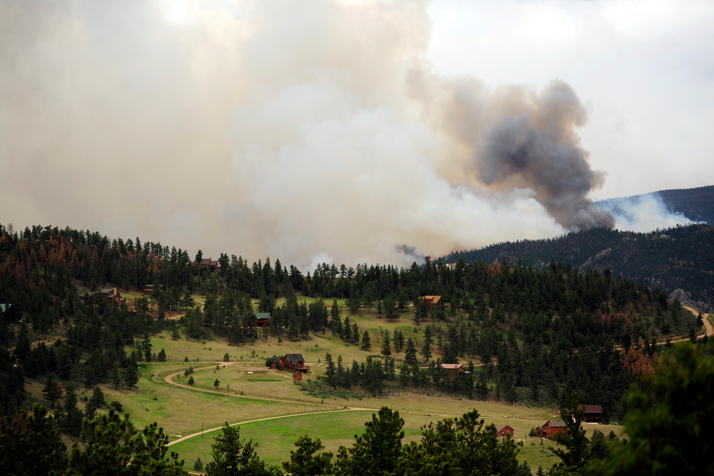 The High Park fire burns on Stove Prairie Road and Highway 14 in Poudre Canyon, as seen from Glacier View Meadows, west of Fort Collins, Colo. on June 12.