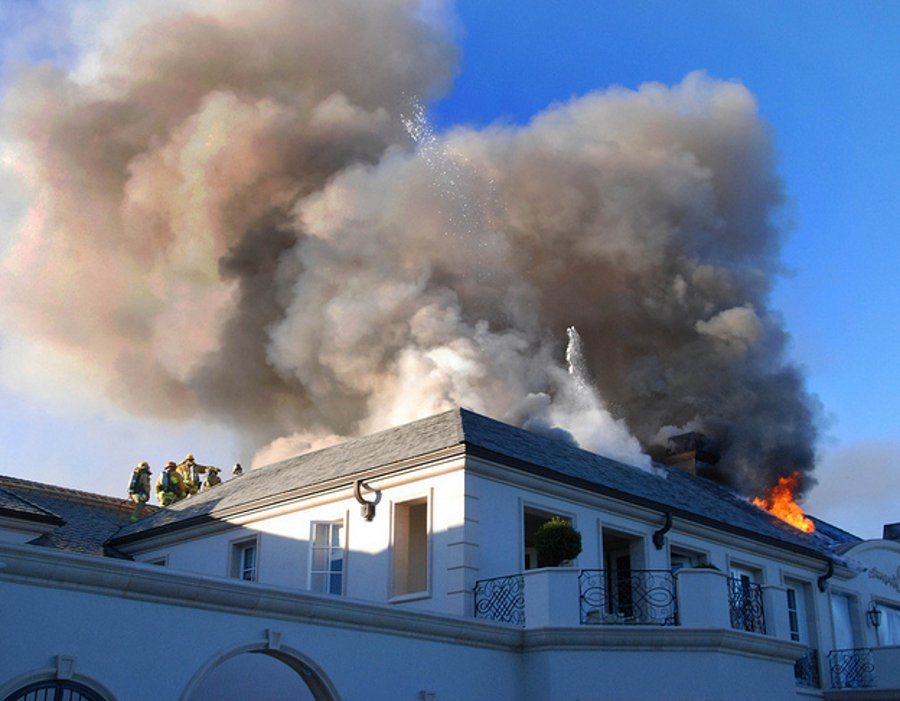 A Beverly Hills firefighter was injured battling a large mansion fire in a gated community Friday night.
