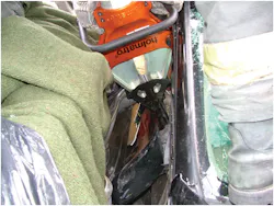 Photo 1. Disentanglement of this patient's arm (below the tips of the tool) from the wreckage needs to be done before the victim can be extricated. Photo 1. Disentanglement of this patient's arm (below the tips of the tool) from the wreckage needs to be done before the victim can be extricated.