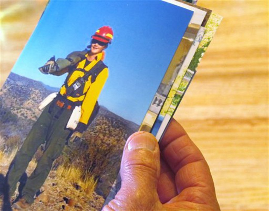Claire Veseth holds a photo of her daughter Anne that was taken earlier this year at a wildfire in Arizona.