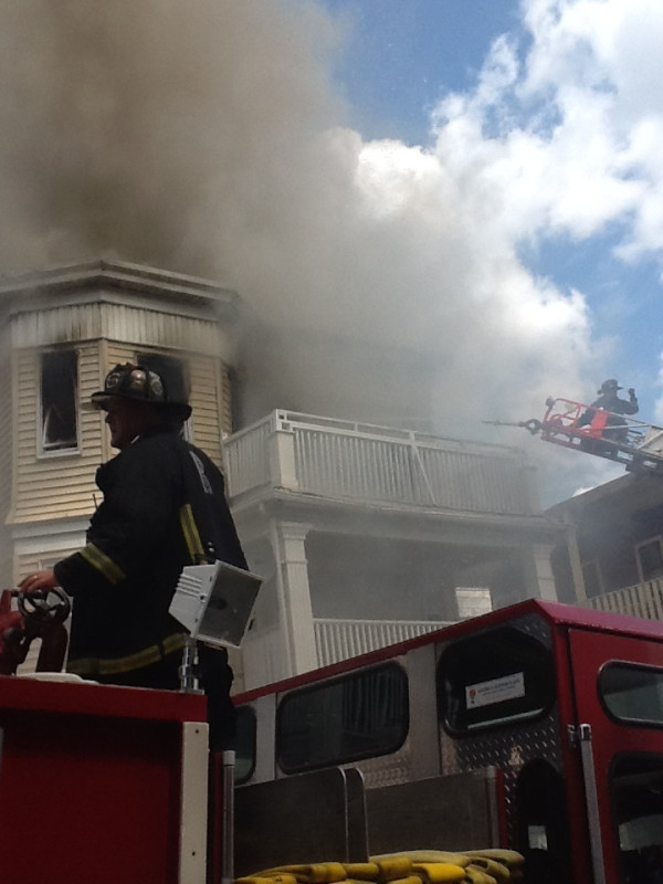 Boston firefighters battled a five-alarm blaze at a triple-decker on Aug. 16.