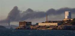 Smoke pours from a fire at the Chevron Richmond Refinery, seen behind Alcatraz Island in San Francisco, on Aug. 6. Smoke pours from a fire at the Chevron Richmond Refinery, seen behind Alcatraz Island in San Francisco, on Aug. 6.