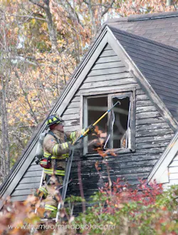 Firefighters battled a three-alarm blaze that tore through a home in Bedford, N.H. on Oct. 23. Firefighters battled a three-alarm blaze that tore through a home in Bedford, N.H. on Oct. 23.