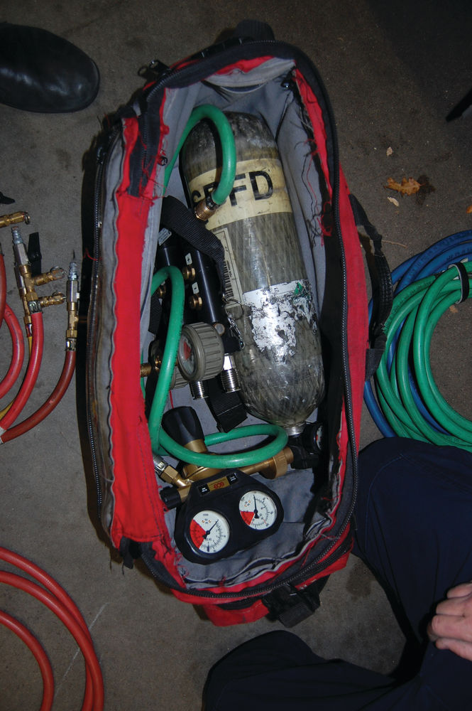 Photo 1 - You don't want to be left unable to complete the operation because equipment was left on the apparatus. This bag contains an air bottle, fittings, control panel, hoses and more.