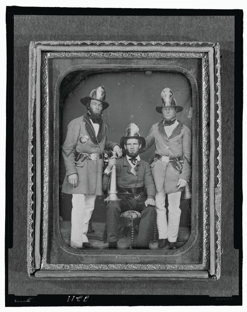 Foremen from the Phoenix Fire Company and Mechanic Fire Company in Charleston, SC, pose for a Daguerreotype, circa 1855.