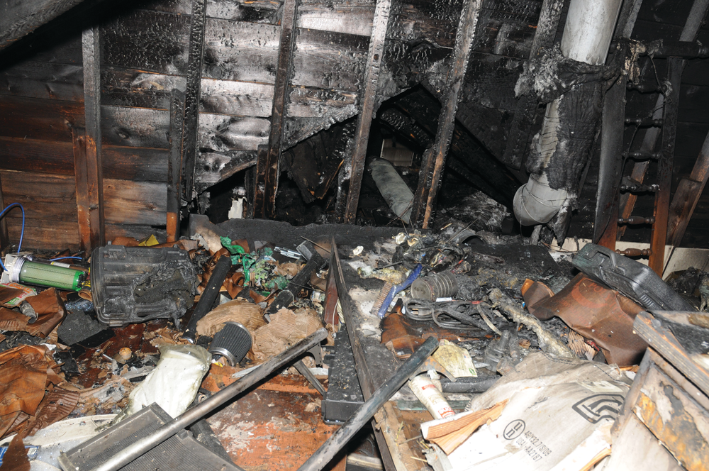 Firefighter Stephen Makos: 'We advanced a dry line up the stairs to the second floor, where we found access to the attic stairwell. When we opened the door, we encountered thick smoke with no visibility. Captain Boutin called for water and we continued to advance to the top of the stairs. At the top, we were met with high heat and no visibility.'