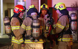 Eagan firefighters wearing the new European-style helmets, gather at the scene of a two-alarm apartment recently. Eagan firefighters wearing the new European-style helmets, gather at the scene of a two-alarm apartment recently.