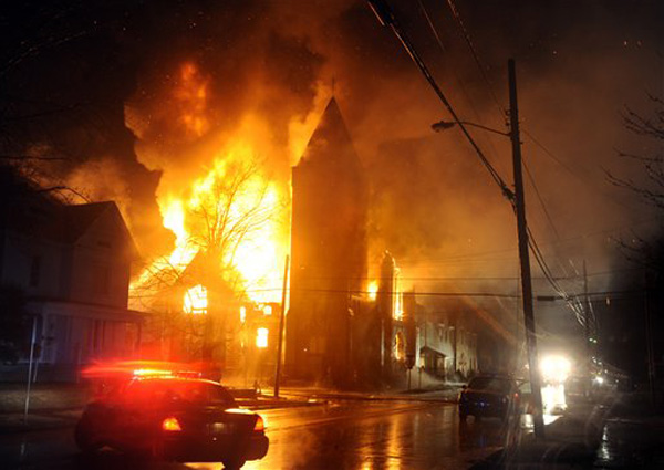 Flames erupt from First Christian Church Disciples of Christ at 700 J.R. Miller Blvd., early Monday, March 18, 2013, in Owensboro, Ky. Firefighters were called to the scene at 3:22 a.m. according to Owensboro Fire Department Chief Steve Mitchell. Mitchell says lightning accompanying a storm likely caused the blaze that gutted the auditorium of the church and cut off power to the neighborhood, including Brescia University.