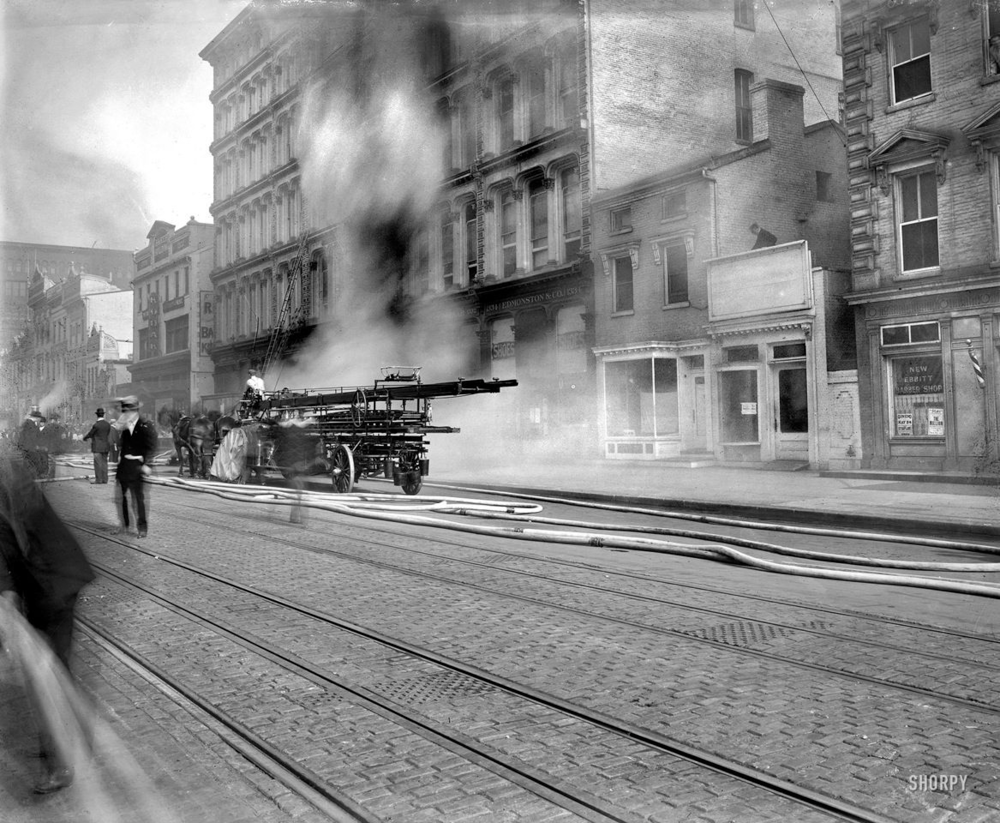 Firefighters attack a basement fire in the U.S. Geological Survey building fire on F Street NW in Washington, DC, on May 18, 1913.