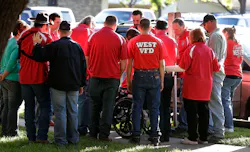 Members of the West Volunteer Fire Department gather after attending a service at St. Mary's Church of the Assumption on Friday. Members of the West Volunteer Fire Department gather after attending a service at St. Mary's Church of the Assumption on Friday.